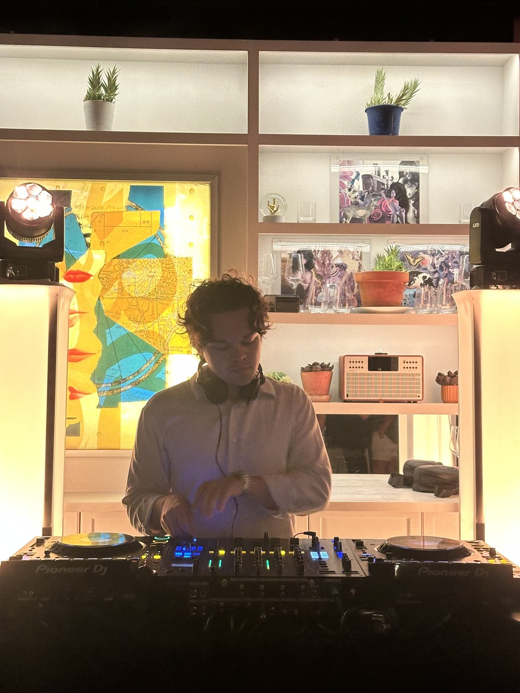 J TISTA focused on the mixer during a live set